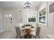 Cozy breakfast nook featuring a round table, four chairs, and a modern chandelier for intimate dining at 800 Camden Ave, Durham, NC 27701