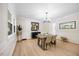 Elegant dining room with hardwood floors, stylish lighting, and ample natural light at 800 Camden Ave, Durham, NC 27701