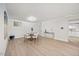 Bright dining room area featuring a dining table with chairs and hardwood floors at 800 Camden Ave, Durham, NC 27701