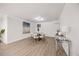 Bright dining room area featuring a dining table with chairs and hardwood floors at 800 Camden Ave, Durham, NC 27701