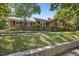 Charming single-story brick home featuring well-maintained landscaping and classic design elements at 800 Camden Ave, Durham, NC 27701