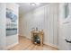 Bright hallway boasts modern decor, stylish wall paneling, and hardwood floors at 800 Camden Ave, Durham, NC 27701