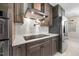Modern kitchen featuring stainless steel appliances, stylish cabinets, and a sleek range hood at 800 Camden Ave, Durham, NC 27701