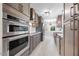 Spacious kitchen with stainless steel appliances, stylish cabinets, and tile flooring at 800 Camden Ave, Durham, NC 27701