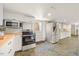 Open kitchen features stainless steel appliances and white cabinets, ideal for modern living at 800 Camden Ave, Durham, NC 27701