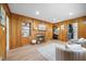 A home living room with built in shelves, a fireplace, and bright windows overlooking the yard at 800 Camden Ave, Durham, NC 27701
