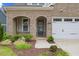 Charming brick home with a well-manicured front yard and inviting entrance at 857 Whistable Ave, Wake Forest, NC 27587