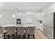 Beautiful kitchen with a large island, stainless steel appliances, and white cabinetry at 857 Whistable Ave, Wake Forest, NC 27587