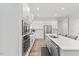Modern kitchen featuring stainless steel appliances and white countertops at 857 Whistable Ave, Wake Forest, NC 27587
