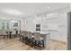 Open concept kitchen with an island, breakfast bar, and modern appliances, ideal for cooking and dining at 857 Whistable Ave, Wake Forest, NC 27587