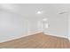 The living room featuring hardwood floors, neutral walls, and recessed lighting at 857 Whistable Ave, Wake Forest, NC 27587