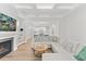 Bright living room featuring a cozy fireplace, coffered ceilings, and an open floor plan at 857 Whistable Ave, Wake Forest, NC 27587