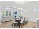 Open floorplan featuring a dining area and living room with a fireplace and lots of natural light at 857 Whistable Ave, Wake Forest, NC 27587