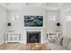 Cozy living room with a fireplace, TV, and comfortable seating for relaxation and entertainment at 857 Whistable Ave, Wake Forest, NC 27587