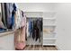 Walk-in closet with two rods for hanging and shelving at 857 Whistable Ave, Wake Forest, NC 27587