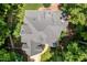 Aerial view of the house showing roof detail and surrounding greenery at 100 Donald Dr, Pittsboro, NC 27312