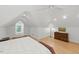 Neutral bedroom with hardwood floors, ceiling fan, natural light, and dresser at 100 Donald Dr, Pittsboro, NC 27312