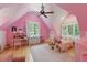 Bright pink bedroom features a ceiling fan, natural light, and whimsical decor at 100 Donald Dr, Pittsboro, NC 27312