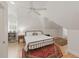 Neutral bedroom with hardwood floors, rug, ceiling fan, and natural light at 100 Donald Dr, Pittsboro, NC 27312