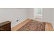 Neutral room with hardwood floors, rug, a dresser, and natural light at 100 Donald Dr, Pittsboro, NC 27312
