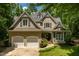 Charming two-story home with a manicured front yard and a two car garage at 100 Donald Dr, Pittsboro, NC 27312