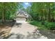 A beautiful home with a two-car garage, well-maintained lawn, and mature trees at 100 Donald Dr, Pittsboro, NC 27312