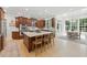 Spacious kitchen boasts a large island, stainless steel appliances, wood cabinets, and a breakfast nook at 100 Donald Dr, Pittsboro, NC 27312