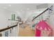 Bright playroom with hardwood floors, table and chairs, and a pink tent at 100 Donald Dr, Pittsboro, NC 27312