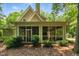 Screened-in porch with view of the backyard and surrounding greenery at 100 Donald Dr, Pittsboro, NC 27312