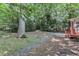 Large backyard featuring mature trees, wooden deck, patio and a pathway at 100 Windvale Ct, Cary, NC 27518