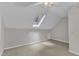 Bright bedroom featuring neutral carpet, ceiling fan and a skylight allowing for natural light at 100 Windvale Ct, Cary, NC 27518