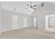 Expansive bedroom with vaulted ceilings, ceiling fan, and neutral carpet at 100 Windvale Ct, Cary, NC 27518