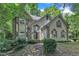 Inviting traditional home with brick details, arched windows, and a lush front yard at 100 Windvale Ct, Cary, NC 27518