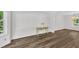Bright living room with new hard wood flooring, ample natural light, and neutral paint at 100 Windvale Ct, Cary, NC 27518