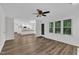 Open-concept space showing living room with wood floors connected to the kitchen at 100 Windvale Ct, Cary, NC 27518