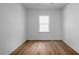 Spacious bedroom features new hardwood floors, fresh paint and a large window for natural light at 1061 Hardin Hill Ln, Knightdale, NC 27545