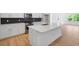 Modern kitchen featuring white cabinets, stainless appliances, and an island for entertaining at 1061 Hardin Hill Ln, Knightdale, NC 27545
