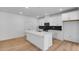 Bright kitchen with island, stainless appliances, and white cabinets, perfect for cooking and entertaining at 1061 Hardin Hill Ln, Knightdale, NC 27545