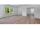 Open living room features beautiful hardwood floors, new paint and lots of natural light at 1061 Hardin Hill Ln, Knightdale, NC 27545