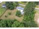 Aerial view of a home with mature trees and a spacious lot at 1067 Thompson Rd, Four Oaks, NC 27524