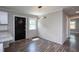 Bright dining area with modern light fixture, and wood-look floors at 1067 Thompson Rd, Four Oaks, NC 27524