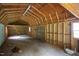 Spacious shed with exposed beams and plenty of room for storage or hobbies at 1067 Thompson Rd, Four Oaks, NC 27524