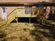 Back deck with stairs and a brick exterior at 1098 Blackstone Dr, Creedmoor, NC 27522