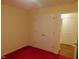 Bedroom featuring red carpet, a closet and access to the en suite bathroom at 1098 Blackstone Dr, Creedmoor, NC 27522
