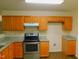 Functional kitchen featuring stainless steel appliances and granite countertops at 1098 Blackstone Dr, Creedmoor, NC 27522