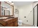 Bathroom with a dark wood vanity, patterned tile floors, and a modern glass shower at 1139 Princeton Kenly Rd, Kenly, NC 27542