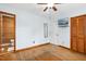 Cozy bedroom featuring hardwood floors, closet, and a television mounted on the wall at 1139 Princeton Kenly Rd, Kenly, NC 27542