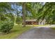 Charming home with brick accents, mature trees and gravel driveway at 1139 Princeton Kenly Rd, Kenly, NC 27542