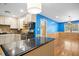 Kitchen with white cabinets, stainless steel appliances, a tile backsplash, and a dark countertop island at 1139 Princeton Kenly Rd, Kenly, NC 27542