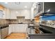 The kitchen is equipped with stainless steel appliances and a mosaic tile backsplash at 1139 Princeton Kenly Rd, Kenly, NC 27542